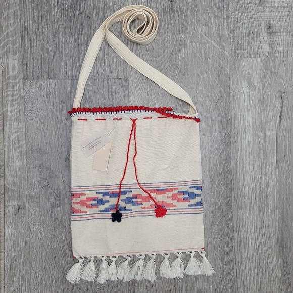Boho fabric crossbody bag with knit string and flowers and fringe. 10"×9" - Picture 2 of 8